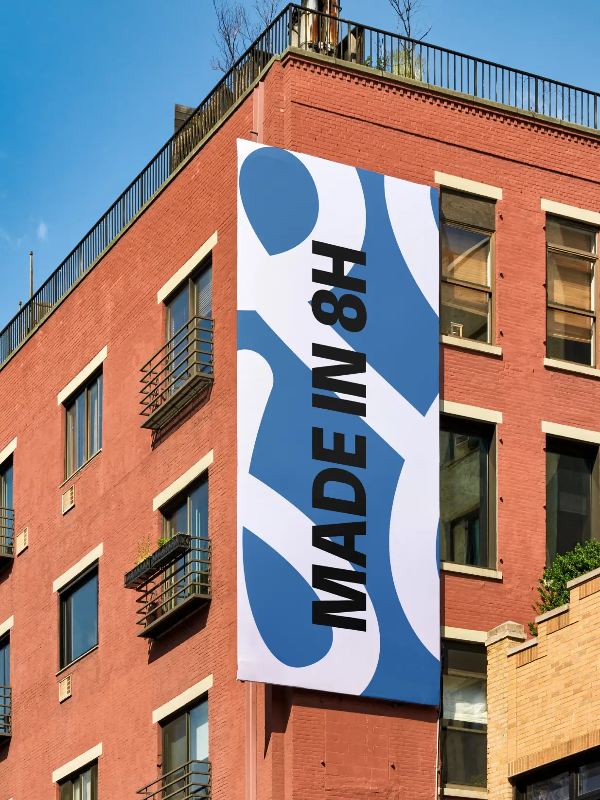 made in 8h branded banner on a building