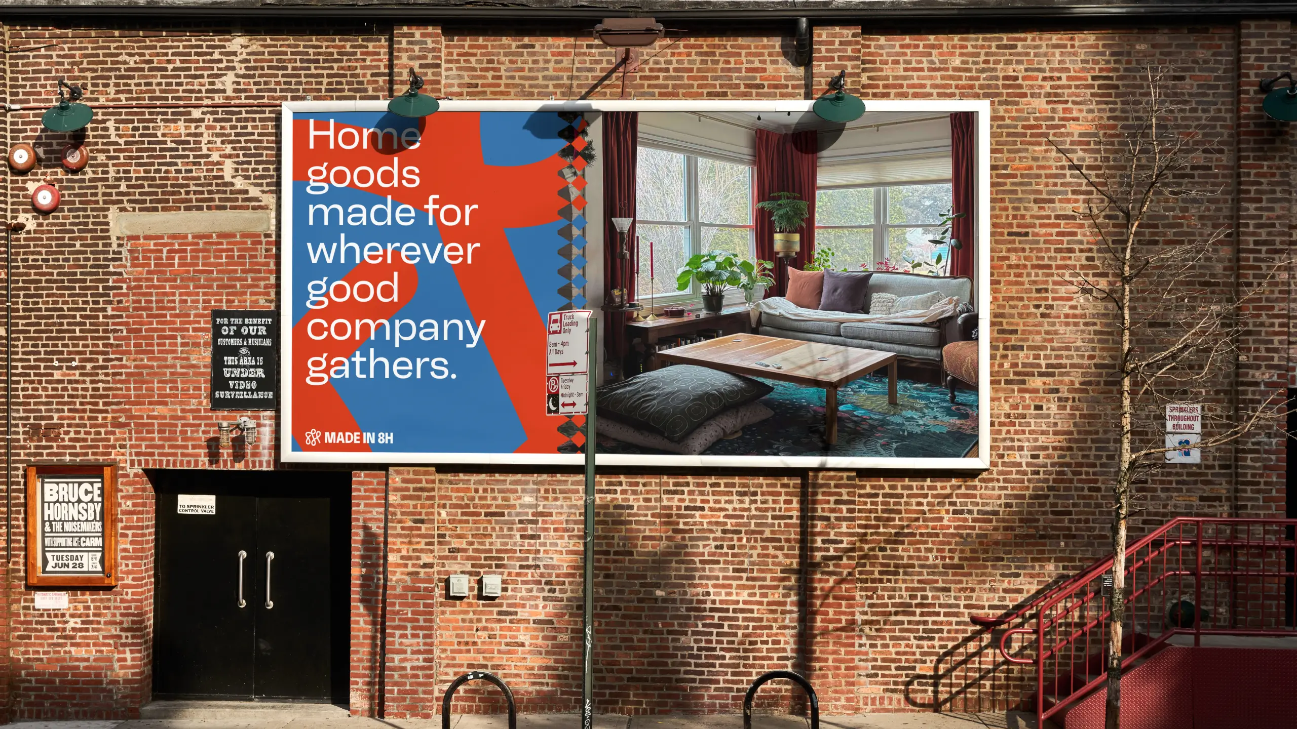 Made in 8H ad on the side of a nyc building. The ad says "home goods made for wherever good company gathers."
